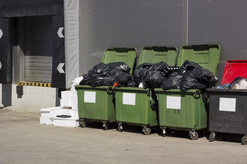 Mid-job shot showing loading of green waste into a Luton van